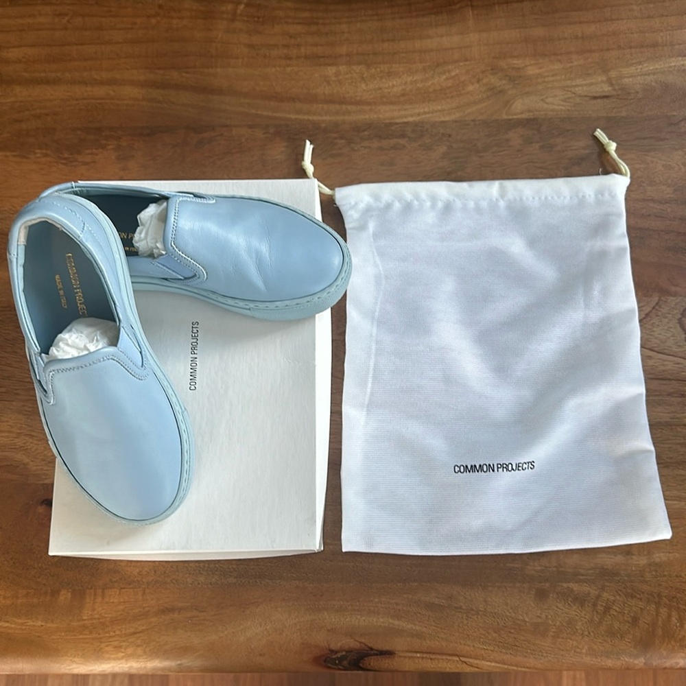Common Projects kids slip on shoes in power blue
